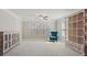 Bright bedroom with neutral carpet, built in cabinetry, and natural light at 6040 Ashborough Park, Cumming, GA 30040