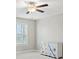 Bright bedroom with carpet flooring, a ceiling fan and furniture for storage at 6040 Ashborough Park, Cumming, GA 30040