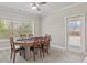 Open concept game room with a round poker table and lots of natural light at 6040 Ashborough Park, Cumming, GA 30040