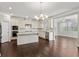 Modern kitchen featuring white cabinetry, stainless steel appliances, and a center island at 6040 Ashborough Park, Cumming, GA 30040