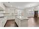 Bright, spacious kitchen with white cabinets, granite countertops, and stainless steel appliances at 6040 Ashborough Park, Cumming, GA 30040