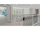 Spacious landing area with elegant black railings, offering an open view of the lower level at 6040 Ashborough Park, Cumming, GA 30040
