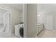 Convenient laundry room with modern appliances, located near the bathroom, adding functionality to the home at 6040 Ashborough Park, Cumming, GA 30040