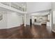 Bright open-concept living room leading to a modern kitchen with stainless steel appliances at 6040 Ashborough Park, Cumming, GA 30040