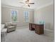 Bright office space with natural light, a comfortable chair, and a modern desk at 6040 Ashborough Park, Cumming, GA 30040