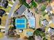 An aerial image reveals the community amenities featuring a pool, tennis courts, clubhouse, and basketball court at 12350 Broadleaf Ln, Johns Creek, GA 30005
