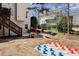 Spacious backyard with patio, mature trees, and lush landscaping provides an outdoor oasis at 12350 Broadleaf Ln, Johns Creek, GA 30005