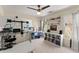 Bedroom featuring carpet, built in shelving, a ceiling fan, and natural light at 12350 Broadleaf Ln, Johns Creek, GA 30005