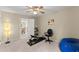 Bedroom featuring carpet, a ceiling fan, and doorway leading to the rest of the house at 12350 Broadleaf Ln, Johns Creek, GA 30005