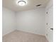 Bright bedroom features neutral carpet, white walls and ceiling with recessed lighting at 12350 Broadleaf Ln, Johns Creek, GA 30005