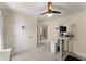 Bedroom with a desk, ceiling fan, and carpeted floor at 12350 Broadleaf Ln, Johns Creek, GA 30005