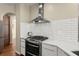 Modern kitchen features stainless steel appliances, white subway tile backsplash, and white countertops at 12350 Broadleaf Ln, Johns Creek, GA 30005