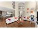 Spacious living room with soaring ceilings, hardwood floors, and an abundance of natural light at 12350 Broadleaf Ln, Johns Creek, GA 30005