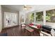 Cozy sunroom with comfortable seating and views of the surrounding landscape at 12350 Broadleaf Ln, Johns Creek, GA 30005