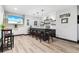 A stylish entertainment space featuring a modern bar with seating, pendant lights, and a large screen TV for a relaxing experience at 4183 Hill House Sw Rd, Smyrna, GA 30082