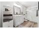 Clean bathroom featuring white cabinets, a large mirror, and a sleek glass-enclosed shower for a modern and spacious look at 4183 Hill House Sw Rd, Smyrna, GA 30082