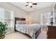 Cozy bedroom featuring a wood-framed bed with patterned bedding, neutral walls, and natural light, creating a relaxing space at 4183 Hill House Sw Rd, Smyrna, GA 30082