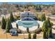 Community pool with a covered building and ample seating surrounded by lush greenery at 4183 Hill House Sw Rd, Smyrna, GA 30082
