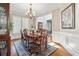 Charming dining room featuring natural light, hardwood floors and a classic chandelier at 4183 Hill House Sw Rd, Smyrna, GA 30082