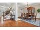 Traditional dining room showcasing a wooden table, elegant chairs, and access to staircase at 4183 Hill House Sw Rd, Smyrna, GA 30082