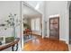 Inviting foyer featuring hardwood floors and a view of the dining room with bright windows at 4183 Hill House Sw Rd, Smyrna, GA 30082