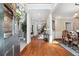 Warm and inviting home foyer with hardwood floors, staircase, and an open view to the dining area at 4183 Hill House Sw Rd, Smyrna, GA 30082
