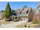 Beautiful two-story home with a well-manicured lawn and inviting front porch at 4183 Hill House Sw Rd, Smyrna, GA 30082