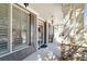 Charming front porch with stone accents, neutral colors, elegant light fixtures, and welcoming entry at 4183 Hill House Sw Rd, Smyrna, GA 30082