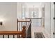 Bright hallway featuring decorative wrought iron railing and a chandelier at 4183 Hill House Sw Rd, Smyrna, GA 30082