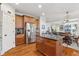 Spacious kitchen featuring a center island with granite countertop open to the dining and living spaces at 4183 Hill House Sw Rd, Smyrna, GA 30082