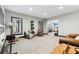 This living room is spacious and bright with neutral carpet and walls, offering versatile space for relaxation and entertainment at 4183 Hill House Sw Rd, Smyrna, GA 30082