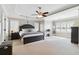 Spacious main bedroom with tray ceiling, shutters, and carpet flooring at 4183 Hill House Sw Rd, Smyrna, GA 30082