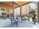Comfortable covered patio with outdoor furniture and decorative rug at 4183 Hill House Sw Rd, Smyrna, GA 30082