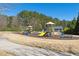 Community playground with swings, slides, and picnic tables, perfect for Gathering fun and recreation at 4183 Hill House Sw Rd, Smyrna, GA 30082