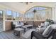 Relaxing screened porch with wicker furniture and sun decor at 4183 Hill House Sw Rd, Smyrna, GA 30082