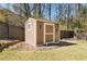 Charming backyard shed with wood siding and a screen door at 4183 Hill House Sw Rd, Smyrna, GA 30082