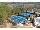 Aerial view of community tennis courts with well maintained blue courts and green surroundings at 4183 Hill House Sw Rd, Smyrna, GA 30082