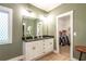 Bathroom with double vanity, and a well-organized walk-in closet at 5761 Dixie Hwy, Rutledge, GA 30663