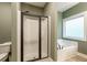 This bathroom features a shower, a soaking tub, and a window for natural light at 5761 Dixie Hwy, Rutledge, GA 30663