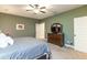 This bedroom features neutral walls, a ceiling fan, and an inviting plush carpet at 5761 Dixie Hwy, Rutledge, GA 30663