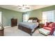 Bedroom with a king bed, side tables, and lots of natural light at 5761 Dixie Hwy, Rutledge, GA 30663