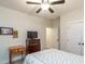 This bedroom features a ceiling fan and natural light at 5761 Dixie Hwy, Rutledge, GA 30663
