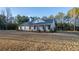 Charming single-story home featuring a welcoming front porch and lush lawn at 5761 Dixie Hwy, Rutledge, GA 30663