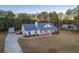 Aerial view of home showing long driveway and lush surrounding greenery at 5761 Dixie Hwy, Rutledge, GA 30663