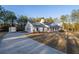 Exterior view of home showing long driveway and lush surrounding greenery at 5761 Dixie Hwy, Rutledge, GA 30663