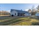 Beautiful exterior view of the home with a lush green lawn and inviting backyard at 5761 Dixie Hwy, Rutledge, GA 30663