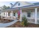 Inviting front porch with decorative seating and charming details at 5761 Dixie Hwy, Rutledge, GA 30663