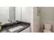 Half bathroom showing sink, vanity, and toilet at 5761 Dixie Hwy, Rutledge, GA 30663