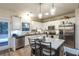 Kitchen with stainless appliances, a kitchen island with chairs, and lots of countertop space at 5761 Dixie Hwy, Rutledge, GA 30663