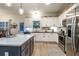 Bright kitchen featuring stainless steel appliances and a gray island at 5761 Dixie Hwy, Rutledge, GA 30663